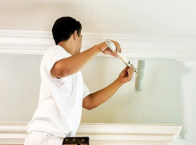 A person painting a wall